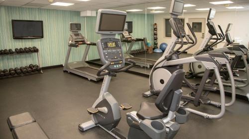 a gym with several treadmills and cardio machines at Holiday Inn Express & Suites Colorado Springs North by IHG in Colorado Springs