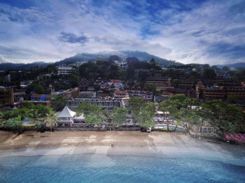 an aerial view of a beach and a city at The Boathouse Phuket - SHA Plus in Kata Beach