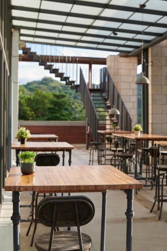 a row of tables and chairs on a patio at Reikei Hot Spring Resort in Baihe