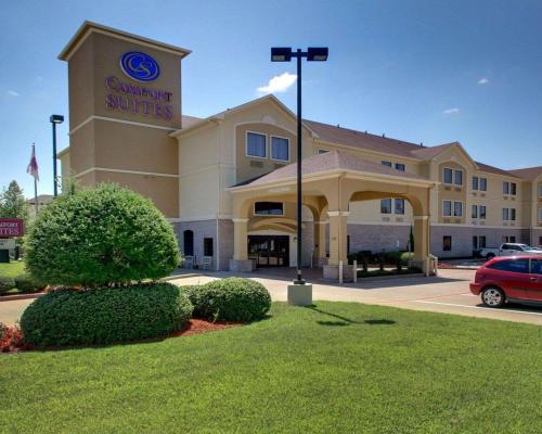 a building with a car parked in front of it at Comfort Suites Tyler South in Tyler
