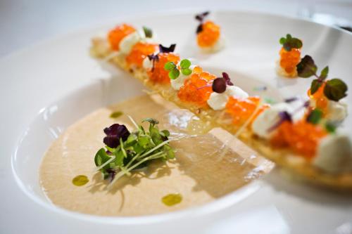 a white plate with two slices of food on it at Ulvsby Herrgård in Sunne