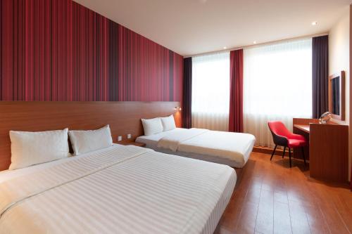 Postel nebo postele na pokoji v ubytování Star G Hotel München Schwabing