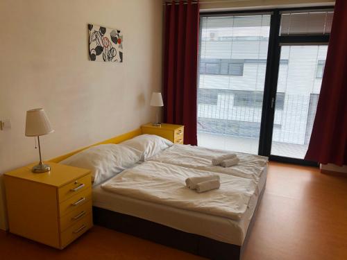 Postel nebo postele na pokoji v ubytování Office Apartments