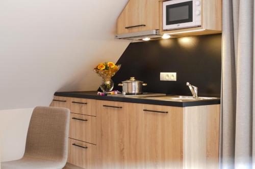 Kuchyň nebo kuchyňský kout v ubytování Hotel Landgasthof Lell