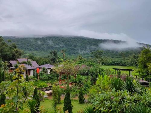 a view of a resort with a mountain in the background at ภูเรือวิว รีสอร์ท in Loei