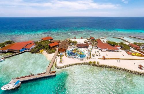 an aerial view of a resort in the ocean at Beachfront Bella Horizonte 7 in Savaneta