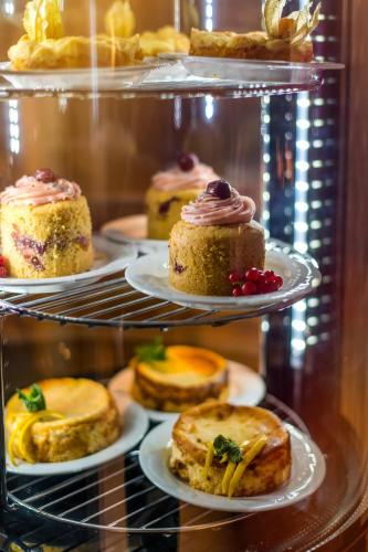 a display case filled with different types of pastries at Moselromantik Hotel Kessler Meyer in Cochem