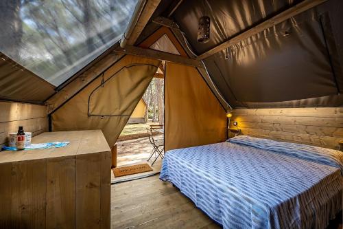 Postel nebo postele na pokoji v ubytování Camping Internazionale Etruria