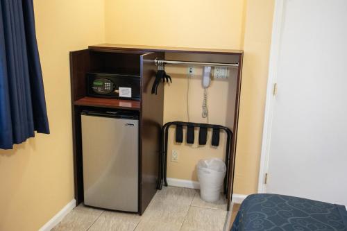 a small kitchen with a refrigerator in a room at The Hotel Hollywood in Los Angeles