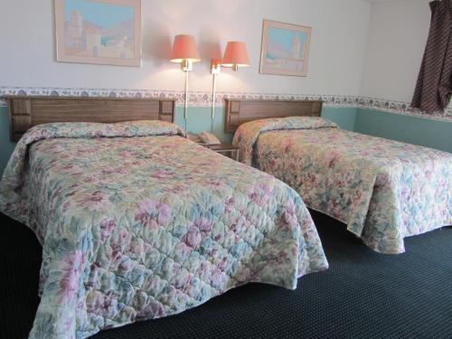 Кровать или кровати в номере Budget Inn Odessa