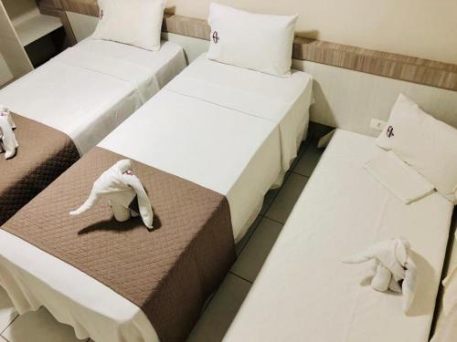 Cama ou camas em um quarto em Âncoradouro Hotel