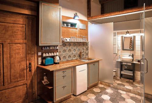 a kitchen with a sink and a counter top at 1881 Brasov old town apartments in Braşov