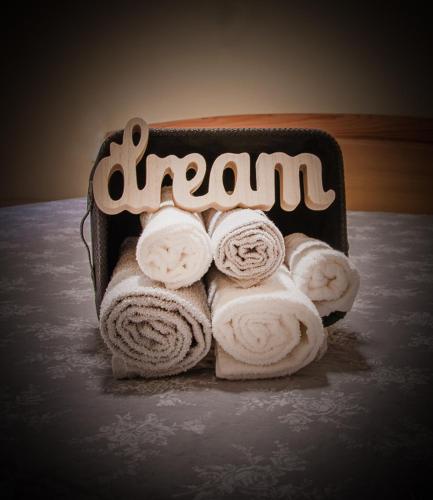 a box of towels with the wordarma on it at Oros House Apartmanház in Orosháza