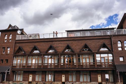 a building with a clock tower on top of it at SPA HOTEL Gora in Bukovel