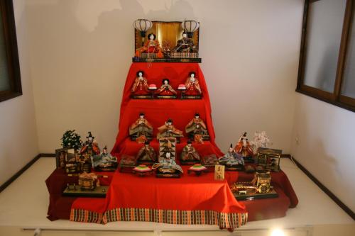 a group of figurines on a table in a room at Guesthouse KYOTO COMPASS in Kyoto