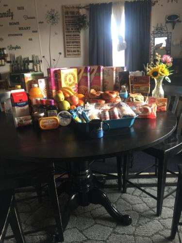 a table with a bunch of food on it at The Runway House in Cantwell