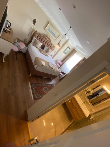 an overhead view of a bedroom with a bed and a living room at elisa hotel in Istanbul