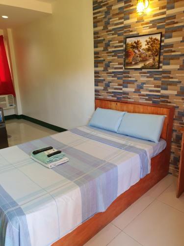 Ένα ή περισσότερα κρεβάτια σε δωμάτιο στο Aosmec Square Hotel