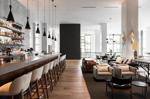 
a kitchen filled with lots of counter tops and chairs at Kimpton Everly Hotel, an IHG Hotel in Los Angeles
