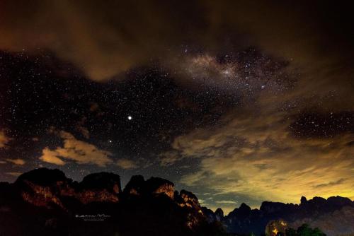 a starry night with the milky way over the mountains at Billion Views Khaosok Homestay in Khao Sok