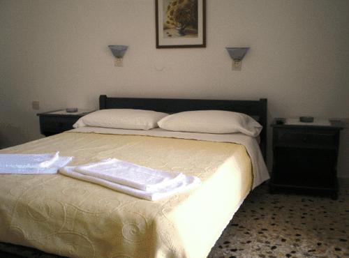 En eller flere senge i et værelse på Villa Maria Vekri