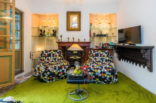 a living room with two chairs and a fireplace at Bon Son Fiol in Felanitx