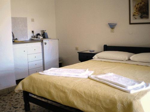 En eller flere senge i et værelse på Villa Maria Vekri