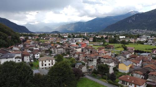 a town in a valley with mountains in the background at Al Carotin in Mantello