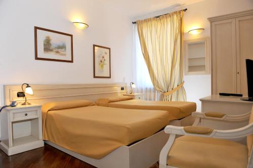 Ένα ή περισσότερα κρεβάτια σε δωμάτιο στο Albergo Birra