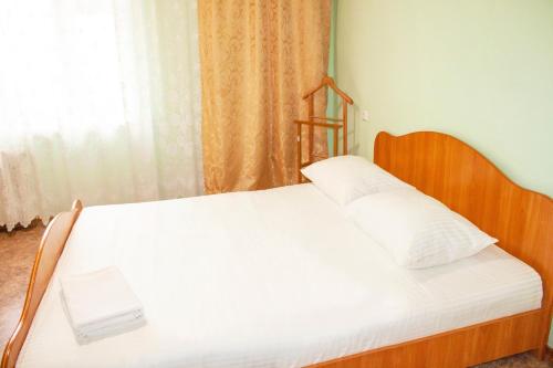 Ένα ή περισσότερα κρεβάτια σε δωμάτιο στο Apartment "Kvartirniy Vopros" on Stroiteley 8