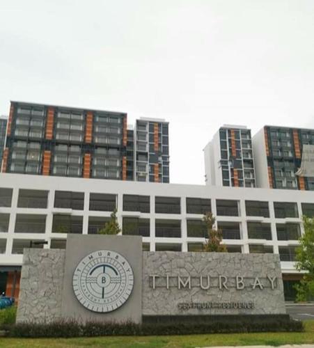 a large building with a sign in front of it at Timurbay Treasures Studio Apartment Side Seaview with Wifi Neflix in Kuantan