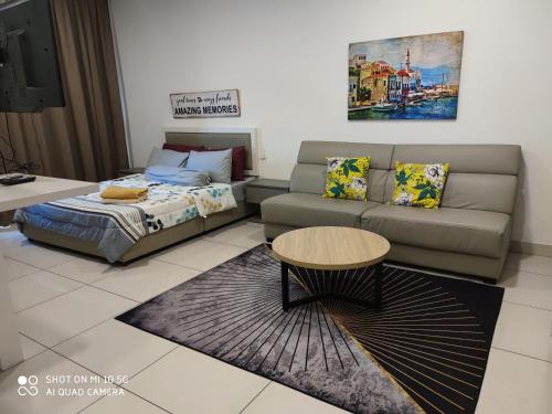 a living room with a couch and a table at EVO Soho Suites, Bangi in Kampong Sungai Ramal Dalam