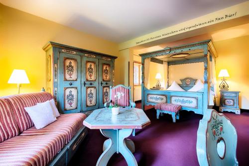 a living room with a couch and a bed at Welcome Hotel Legden in Legden