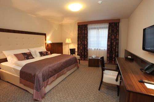 Llit o llits en una habitació de Hotel Sladovna
