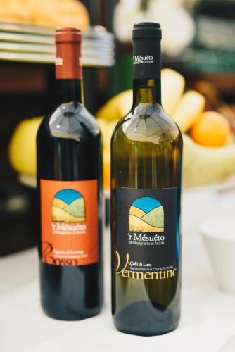 two bottles of wine sitting next to each other at Hotel Corallo in La Spezia