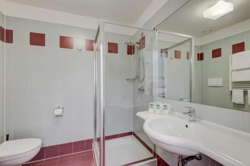 a bathroom with a shower and a sink and a toilet at Camplus Turro Casa per Ferie in Milan