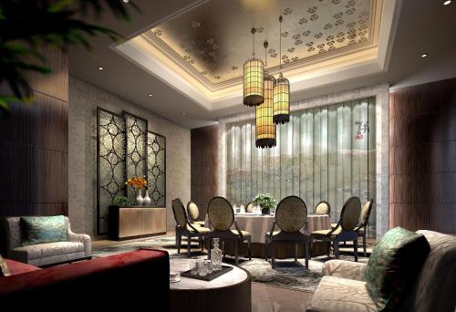 a dining room with a table and chairs at Yangzhong Firth Jinling Grand Hotel in Yangzhong