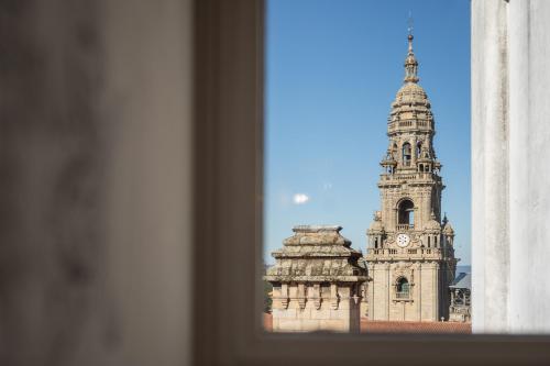 a view of a building with a clock tower at Albergue The Last Stamp in Santiago de Compostela