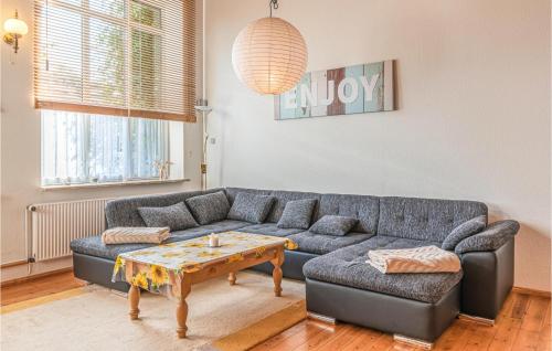 a living room with a couch and a coffee table at Lovely Apartment In Trennewurth in Trennewurth