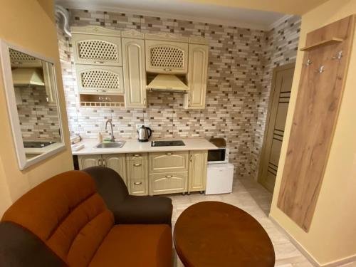 Kuchyň nebo kuchyňský kout v ubytování Man Apartment