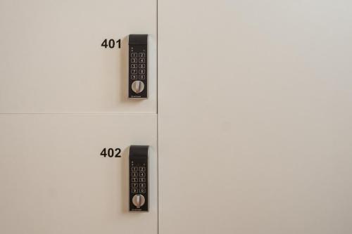 a set of two remote controls on a shelf at Albergue The Last Stamp in Santiago de Compostela