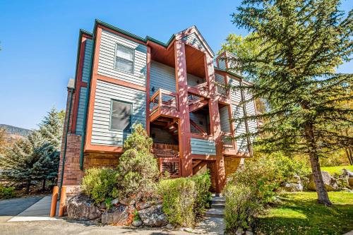 a wooden house with a balcony on the side of it at Mountain Retreat in Basalt