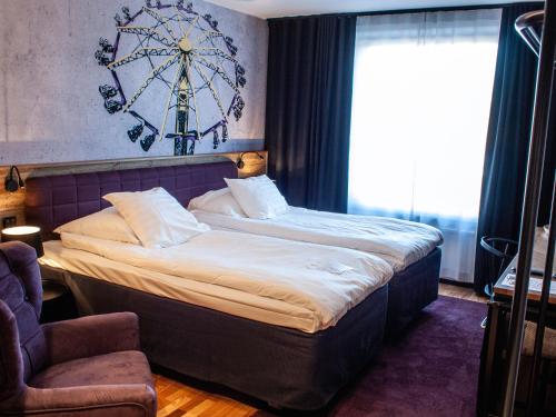a bedroom with a large bed in a room at Original Sokos Hotel Vaakuna Kouvola in Kouvola