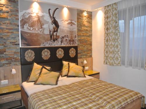 Postel nebo postele na pokoji v ubytování Hotel Baumgartnerhof