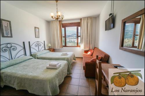 Posteľ alebo postele v izbe v ubytovaní Hostal y Apartamento Rural Los Naranjos