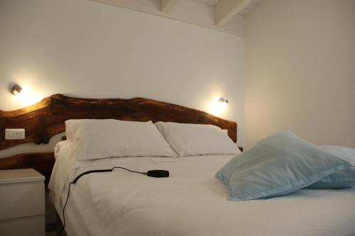 Ένα ή περισσότερα κρεβάτια σε δωμάτιο στο Agriturismo Nona Emma