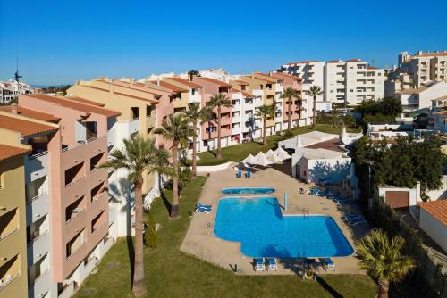 an aerial view of a resort with a swimming pool at Bellavista Avenida By BeGuest in Albufeira