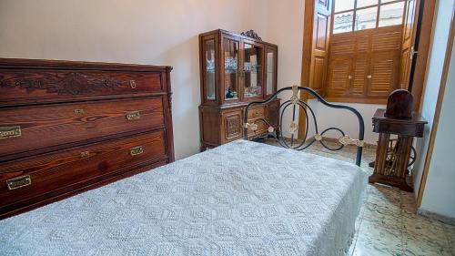 Łóżko lub łóżka w pokoju w obiekcie Casa de los Dragos