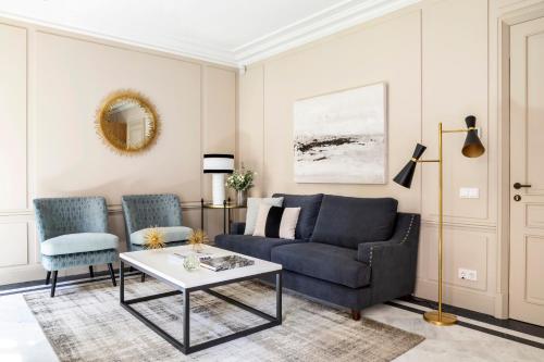 a living room with a couch and two chairs at Ayala 63 - THE ARC COLLECTION in Madrid