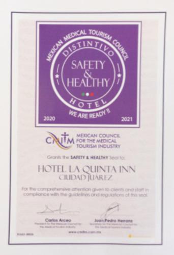 a invitation to a wedding with a purple label at La Quinta by Wyndham Cd Juarez Near US Consulate in Ciudad Juárez